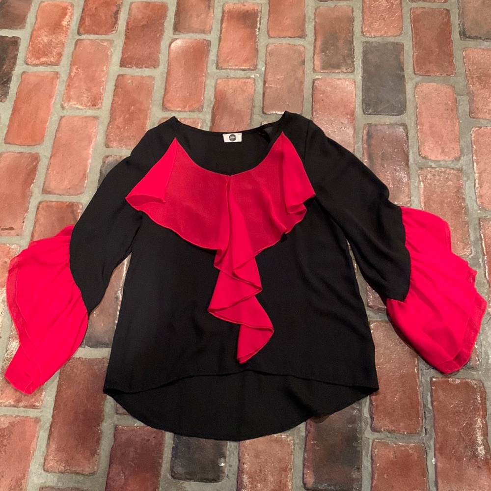 Hi-lo sheer knit top with contrast ruffle front & sleeve detail